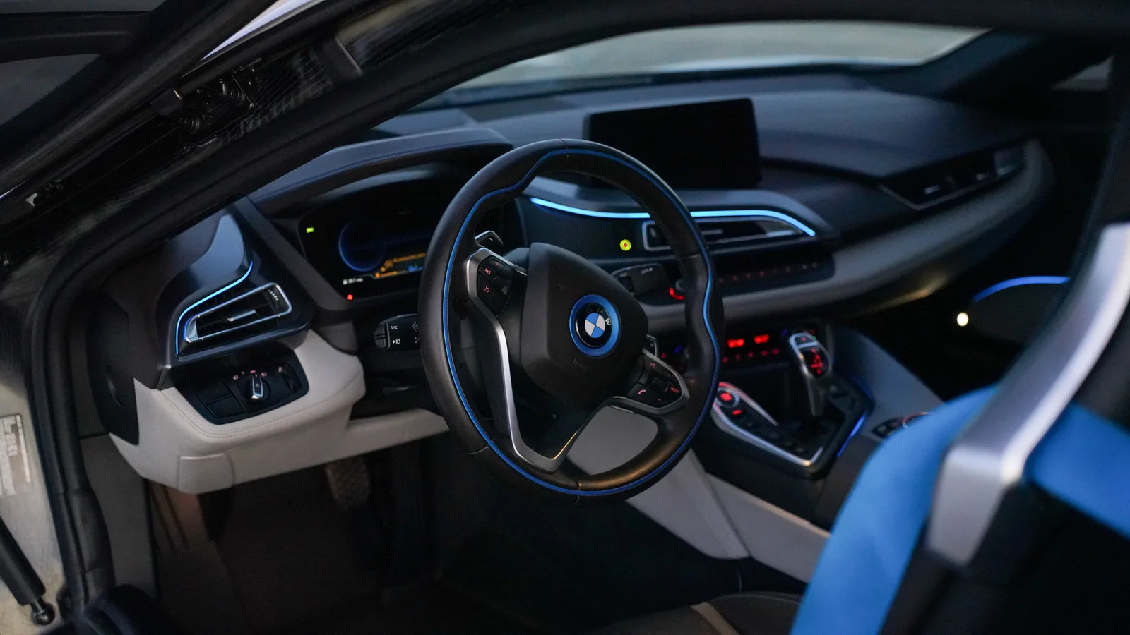 BMW i8 cockpit with blue ambient lighting and leather interior