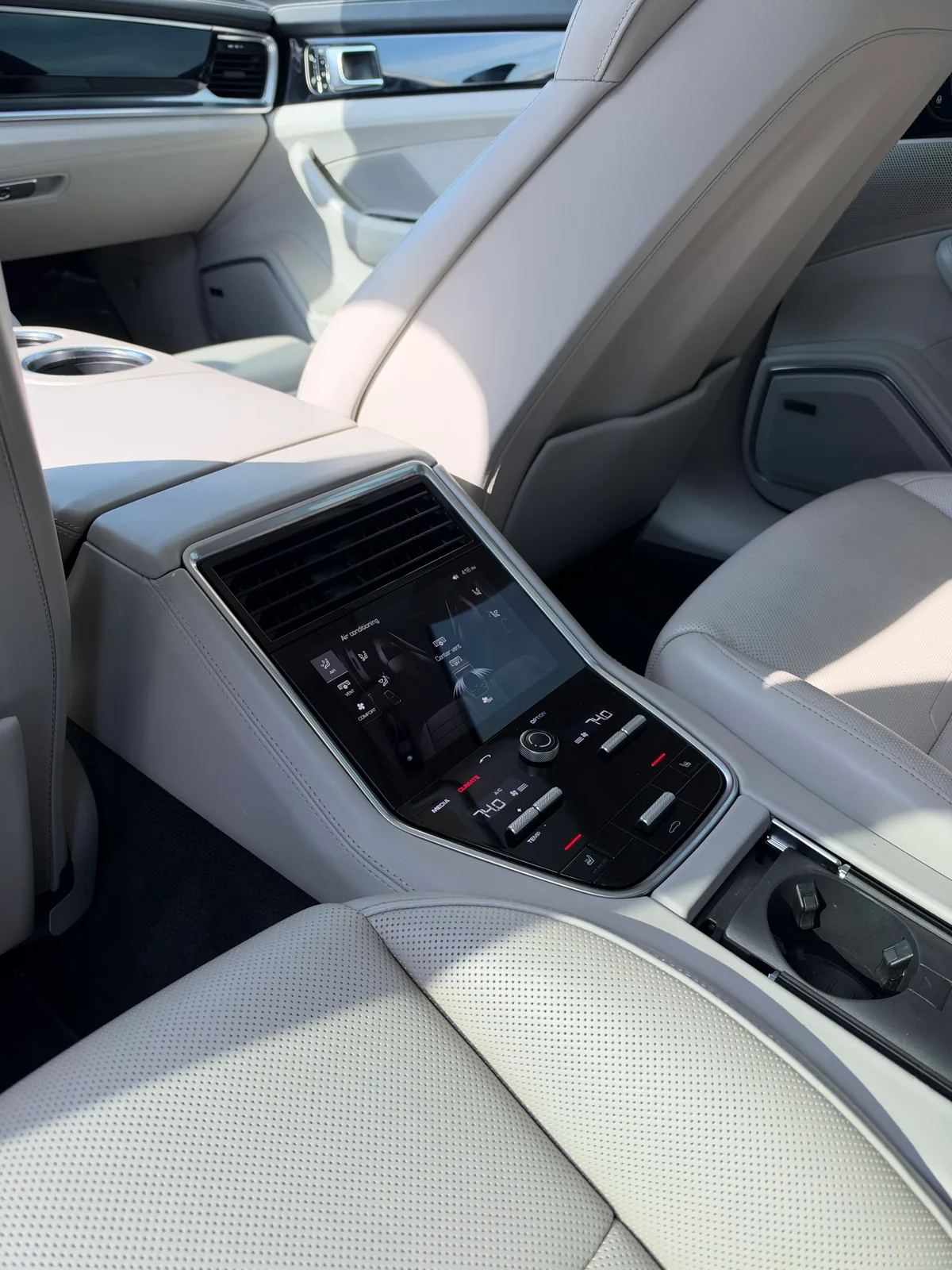 Porsche Panamera cream rear seating and rear climate-control console
