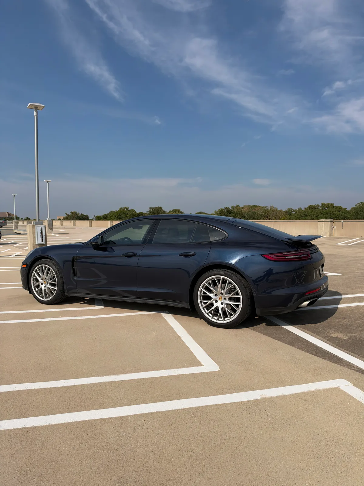 Rear driver-side profile of the Porsche Panamera in Dallas